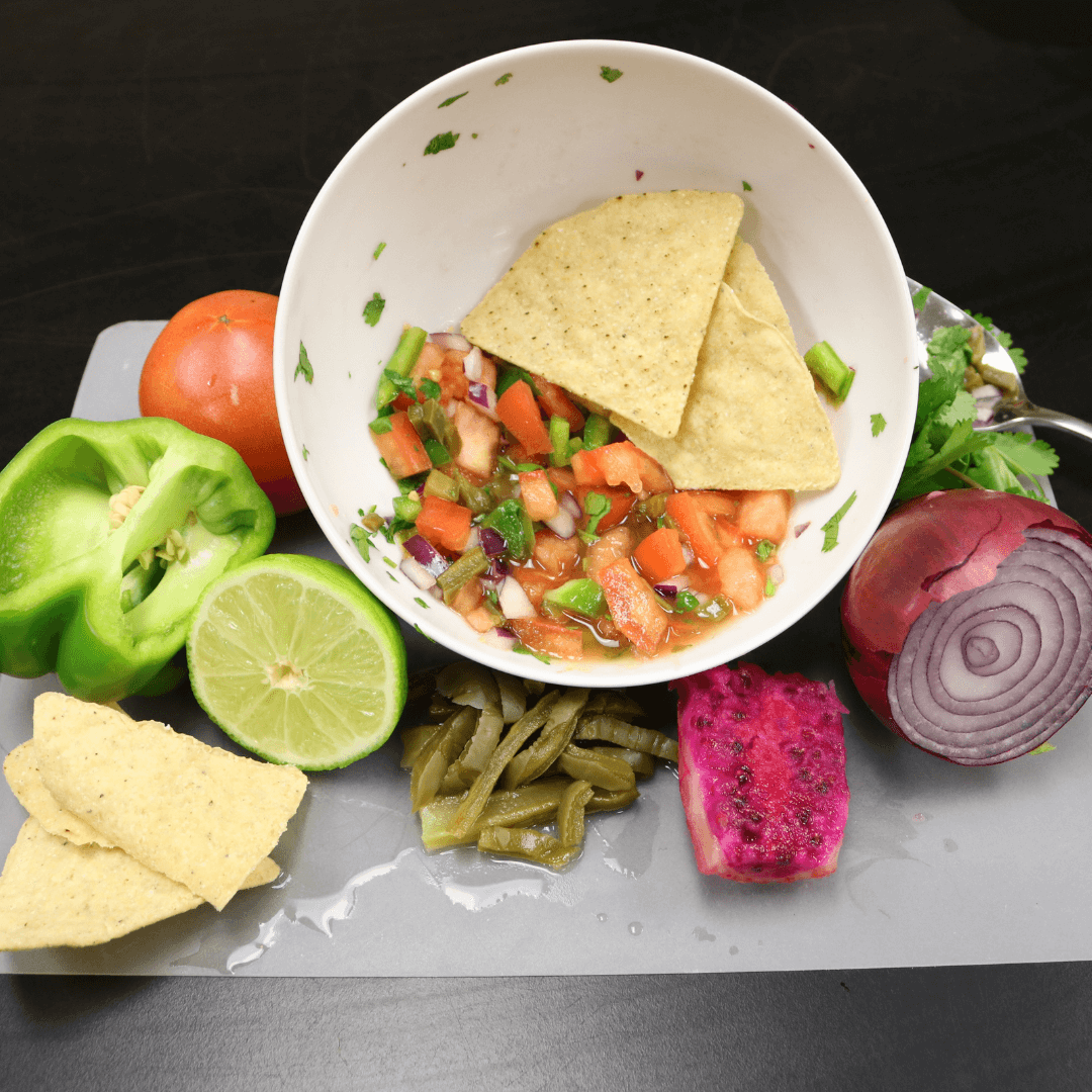 Salsa, and salsa ingredients such as lime, pepper, tomato, onion, and cactus for families to make together. 
